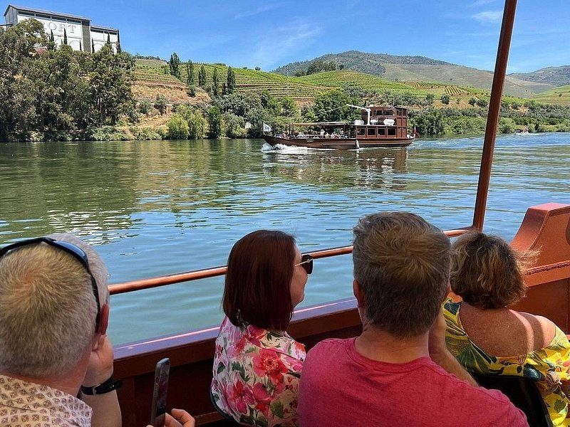 Passengers watching the valley from a Douro cruise deck